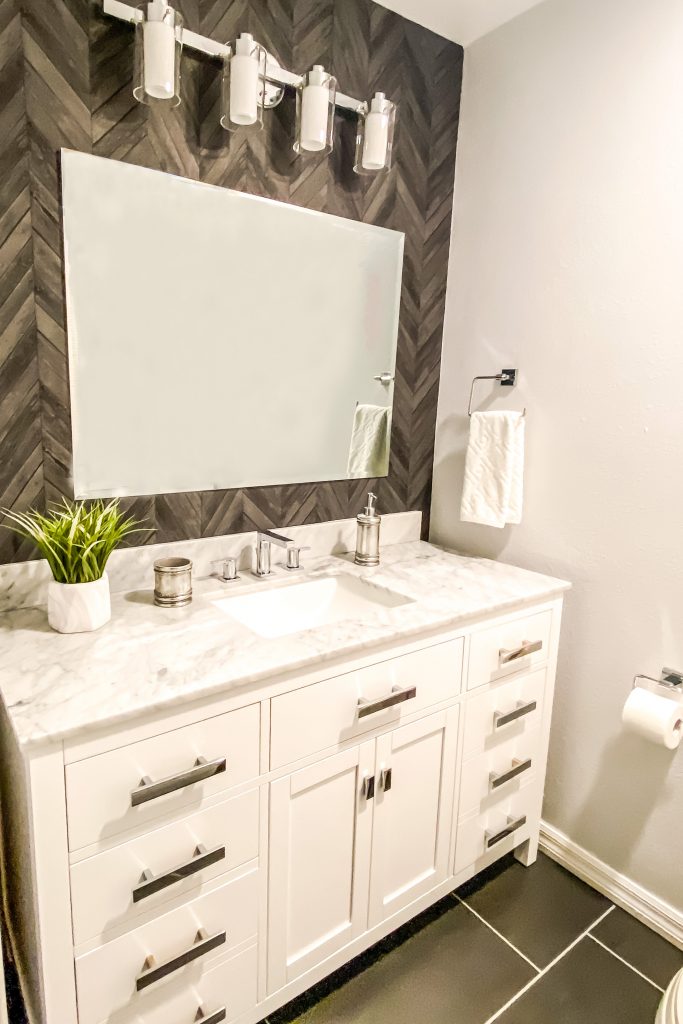 An inexpensive mirror is a way to save on bathroom remodel cost